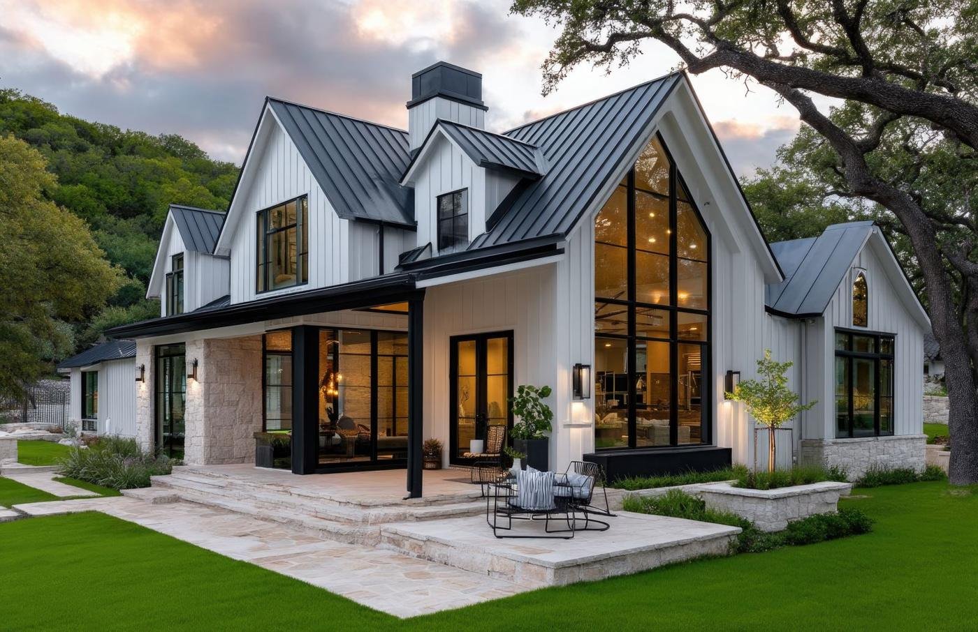 Modern farmhouse at dusk with warm interior lighting