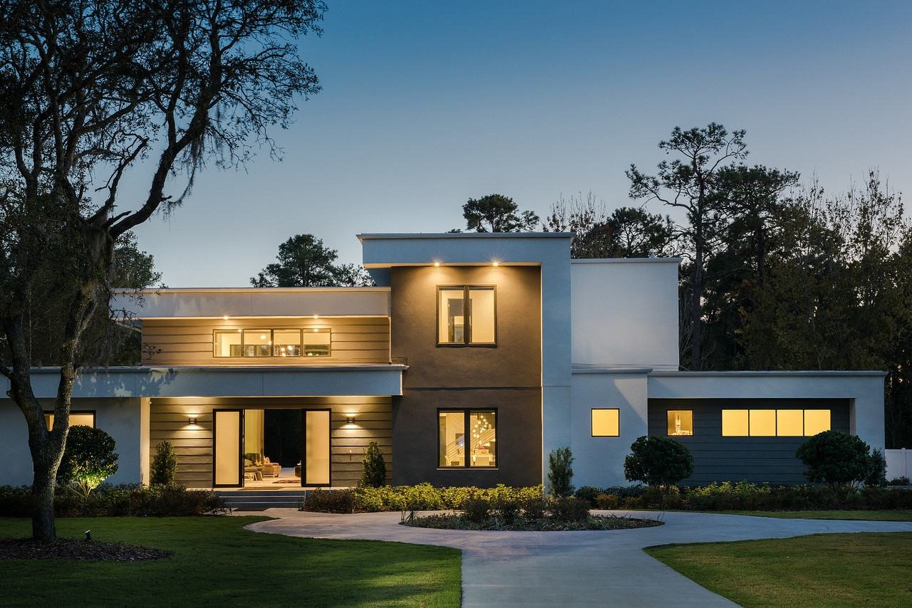 Modern home at dusk with exterior lighting